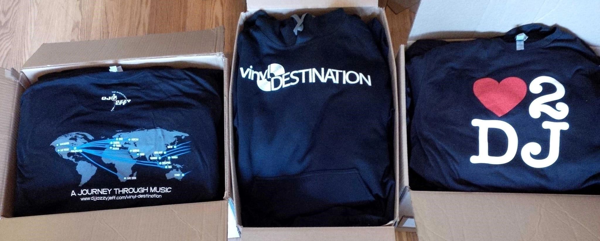 A group of dark garments carries different music and DJ graphics, including Moose Nation lettering and a heart-and-DJ design.