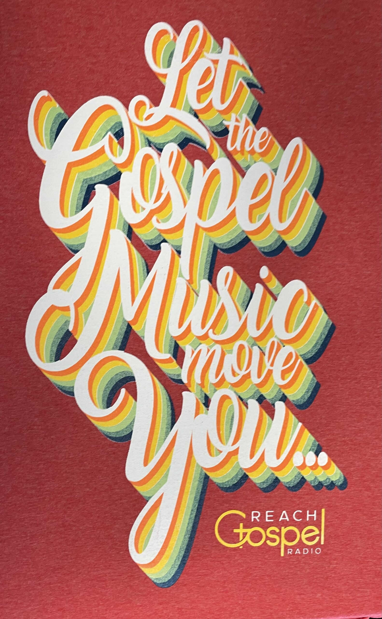 A close-up of flowing, layered lettering in yellow, green and white on a red background. The design reads “Let the Gospel Music Move You.”
