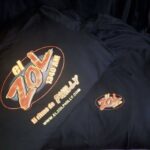 A dark tee carries a bright radio-station-style graphic with warm red, orange and yellow lettering. The surviving thumbnail does not establish the project details.